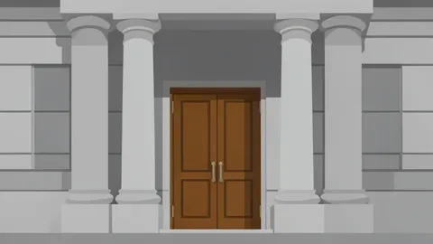 A large stone building facade with heavy columns and a closed bronze door