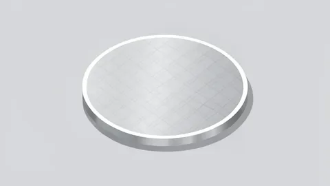 A single silicon wafer resting on a smooth, cleanroom surface.