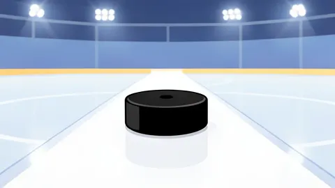 A polished ice hockey rink with a puck resting on the white center line