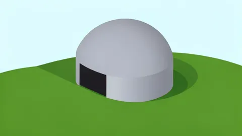 A large, cylindrical metal missile silo dome set into a grassy hillside