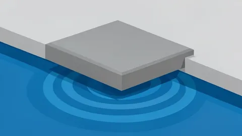 A competitive swimming pool with lane ropes and starting blocks