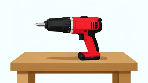 A red and black cordless power drill resting on a wooden workbench