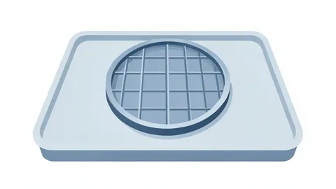 A silicon wafer resting on a cleanroom tray
