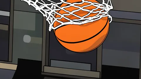 A small indoor basketball court with lowered hoops and a smaller orange ball resting on the floor