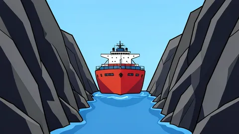 A large container ship anchored in a narrow, rocky strait